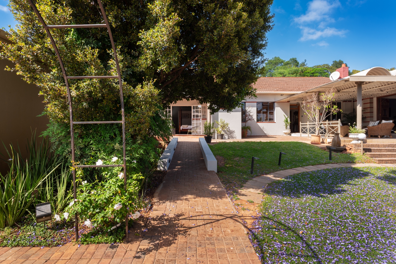 Garden path leading to the guesthouse entrance