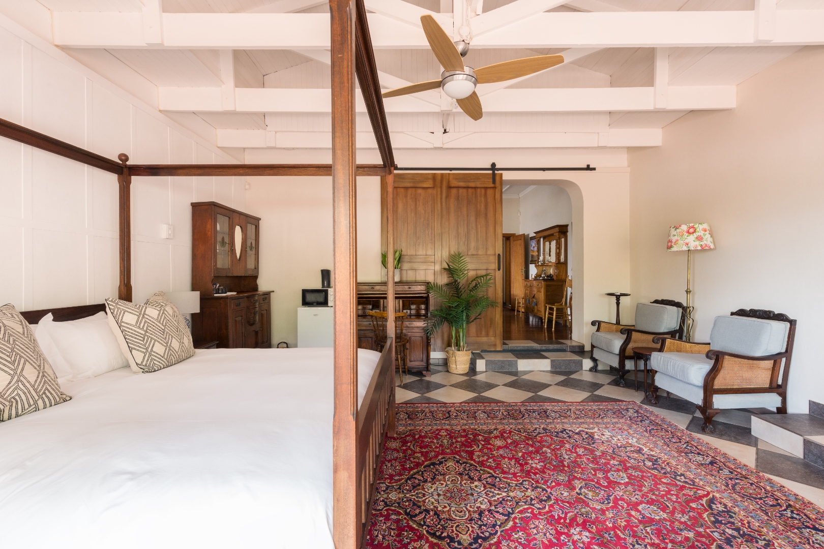 Elegant guest suite with barn-door wardrobe
